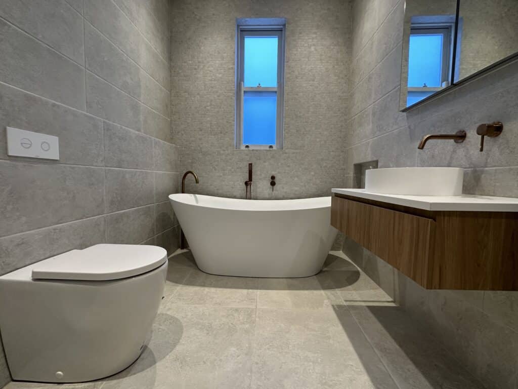 A completed bathroom job that included pipe repair and pipe relining